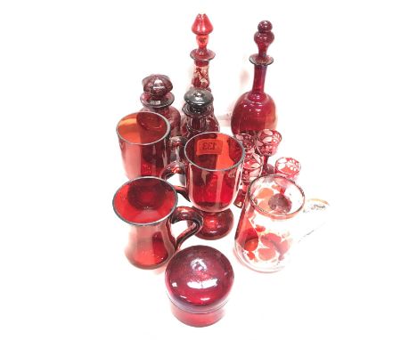 Collection of ruby cut and overlay glass wares, including a small scent bottle and stopper cut with leaping deer in landscape