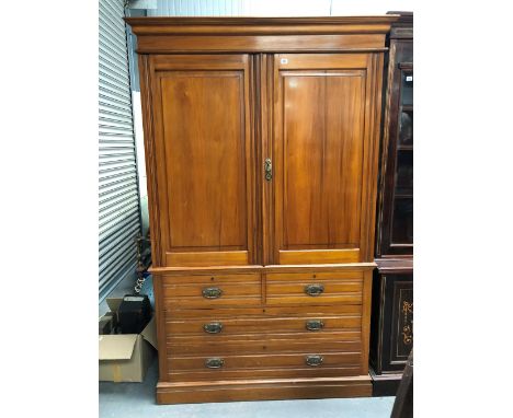 A Victorian yew linen press, the fielded panel doors enclosing four linen slides, the base with two short over two long drawe