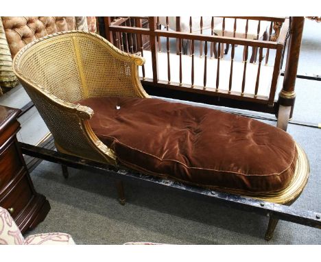 A French Giltwood Daybed, early 20th century, with double skinned bergere sides and velvet cushion, approx 145cm longFrame st