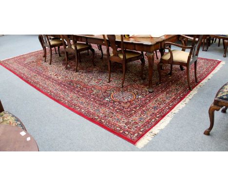 A Machine Made Carpet of Oriental Design, 474cm by 298cm