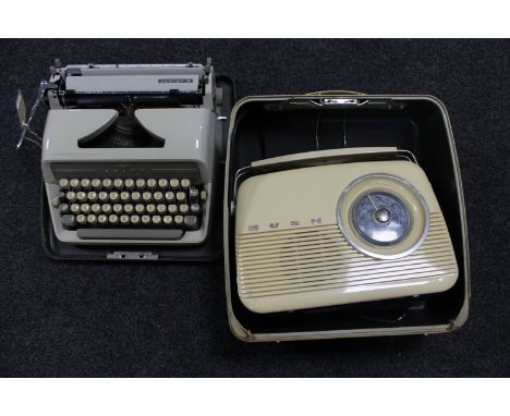 A Bush retro style radio together with an Adler Junior 3 cased typewriter 