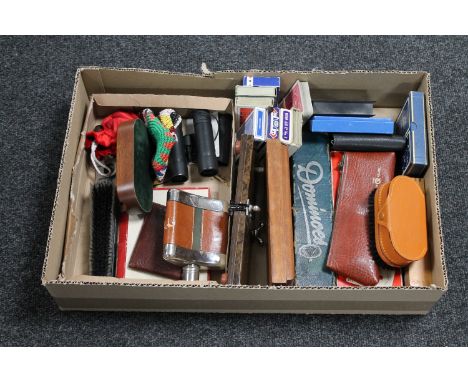 A box of tie presses, playing cards, dominoes, hip flask, binoculars, clothes brush etc 