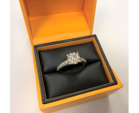 An 18ct white gold diamond cluster ring, approximately 0.5 carat, purchased at Northern Goldsmiths for £1,200. With receipt a