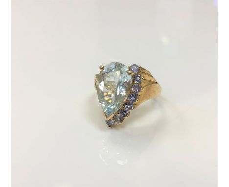 A 9ct gold dress ring set with a pear-cut stone, size L CONDITION REPORT: 4.4g