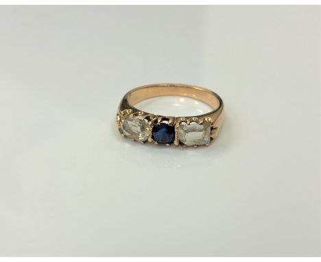 An antique 18ct gold sapphire and diamond three stone ring, size L