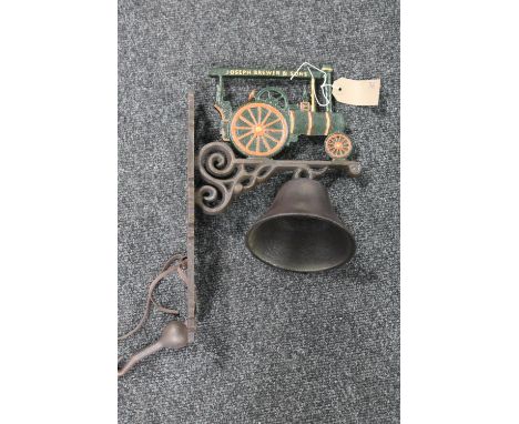 A cast iron traction engine wall bracket with bell