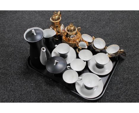 A tray containing a fifteen piece German coffee set together with a fifteen piece gilded tea service 