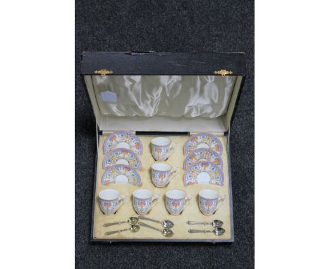 A twelve piece Royal Worcester coffee set together with six silver-gilt spoons in fitted box, Birmingham 1936