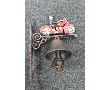 A cast iron vintage motorcycle wall bracket with bell 
