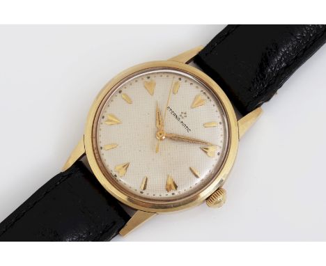ETERNA ¨Eternamatic¨ vintage Herrenarmbanduhr - rundes Gelbgold Gehäuse (gepunzt), D 32mm, silberfarbenes, guillochiertes Zif
