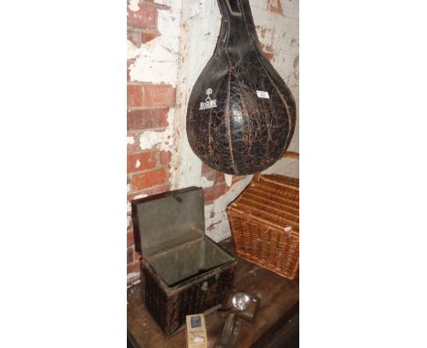A McGurk hanging leather punch bag, an old tin and contents, a WW2 Army cycle lamp and others