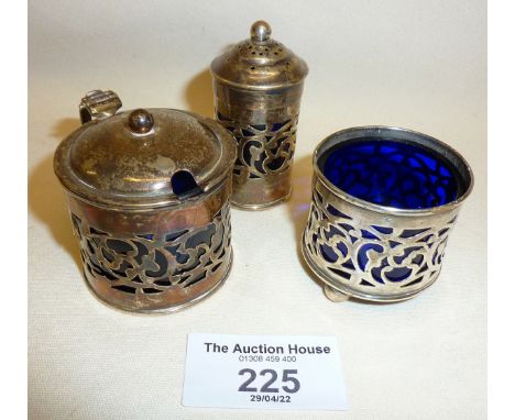 Three piece silver cruet set with blue glass liners, hallmarked for Birmingham 1919, William Hutton &amp; Sons