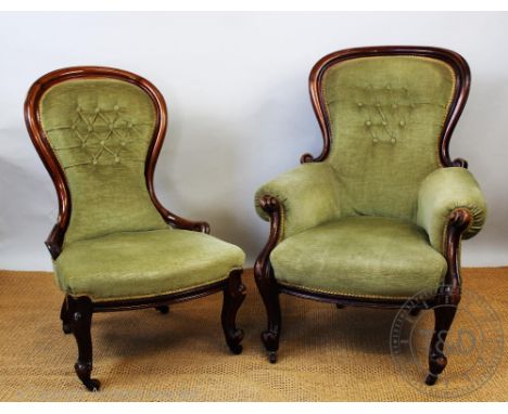 A near pair of  Victorian carved walnut salon chairs, with button back green upholstery, on scroll legs, one with arms, talle