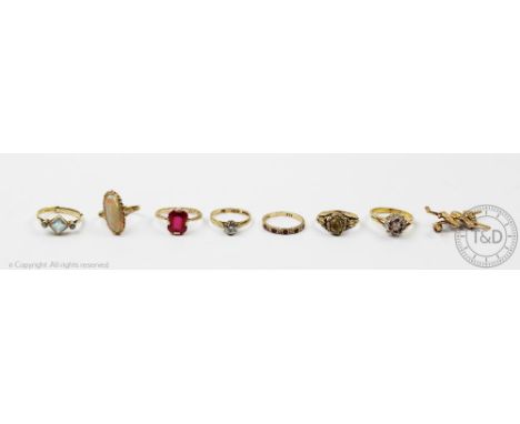 A selection of rings, to include; a citrine set, a half eternity ring, an opal ring and four further rings, along with a golf