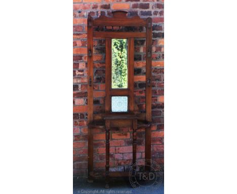An Edwardian walnut hall stand, with mirror and tile back, 205cm H (At fault)