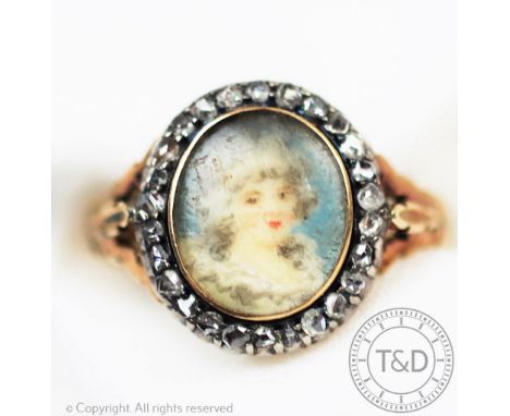 A 19th century yellow metal and diamond set portrait ring, the oval ring set with a portrait of a maiden, possibly on ivory, 