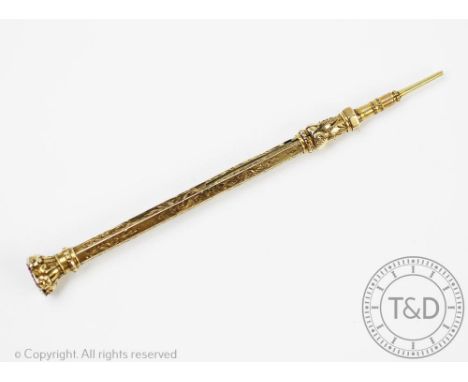 A 19th century gilt metal propelling pencil, florally chased decoration with amethyst set terminal, 11.5cm long