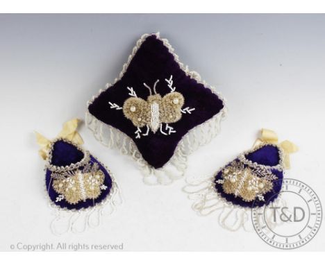 A royal purple pin cushion, with beaded fringing and beaded butterfly design to the top, 14cm x 14cm, along with two matching