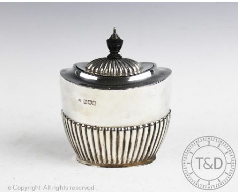 An Edwardian silver tea caddy, Robert Pringle &amp; Sons, London 1904, of oval form with hinged cover and fluted embossed low