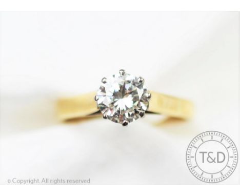A diamond solitaire ring, the brilliant cut diamond (measuring approximately 1.10ct) within eight claw, white metal setting a