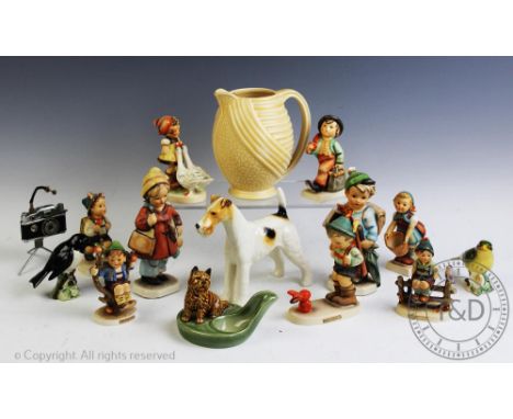 An assortment of collectable ceramics to include, six West German Goebel figures, a Wade jug, a Wade cigar holder, a novelty 