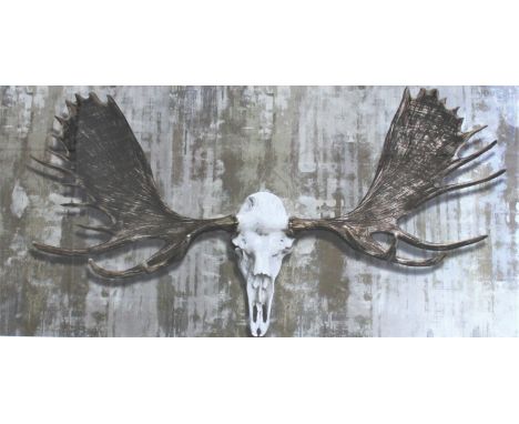 A large pair of modern prints of animal skulls / antlers, in grained frames, 128cm x 77cm overall, with a similar modern prin