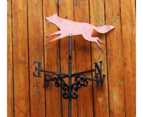 A cast and wrought iron weather vane, modelled with a fox, 90cm H, mounted onto a long bracket, 135cm