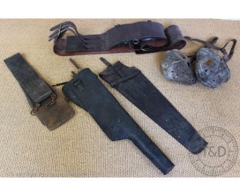 A tan leather horse roller, with brass fittings, with a  late 19th century black and brass horse bridle, with blinkers, two l