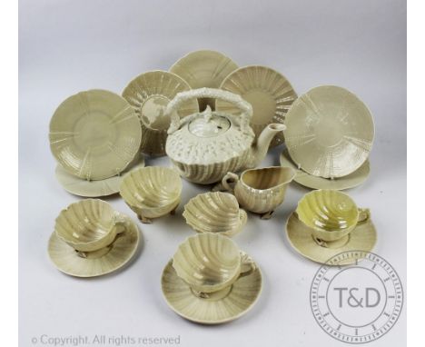 A selection of Belleek shell shaped scalloped tea wares, to include; a teapot and cover, three teacups and saucer, two sugar 