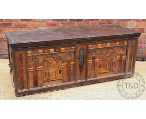 A 18th century and later parquetry inlaid cassone, possibly North Italian, the front carved with two arched panelled with an 