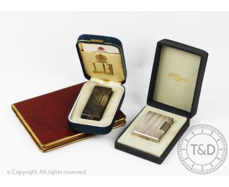 An ST Dupont white metal cigarette lighter, with geometric detailing, number ET8066, in original box, with a silver plated Du