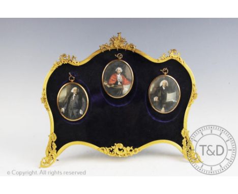 A French gilt metal miniatures box frame, of Louis XV design, the shaped frame with hinged cover enclosing a velvet lined int
