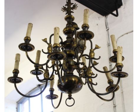 A Dutch style brass ceiling light, ten light, cast with a double headed eagle, 79cm high CONDITION REPORT: Lighting lots are 