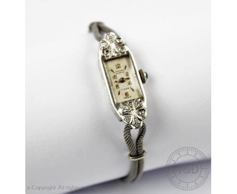A ladies Art Deco diamond set cocktail watch, by 'Jaquet Geneve', the elongated rectangular face with diamond set points, enc