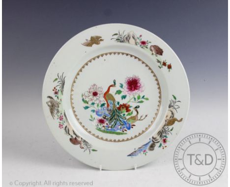 A 19th century Chinese famille rose export porcelain plate, decorated with a peacock, peahen, peonies and birds, 32cm diam CO