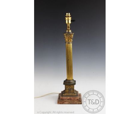 An Edwardian gilt metal and marble lamp, modelled as a fluted Corinthian column, 54cm  CONDITION REPORT: Lighting lots are so
