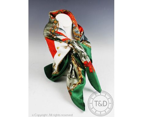 An Hermes Paris silk scarf, in 'Napoleon' design, decorated with medals, swords, flags in a green, red and white colour palet