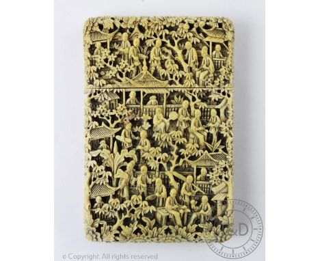 A 19th century Cantonese carved ivory calling card case, profusely decorated with figures and pagodas, 11.5cm (chip to the li