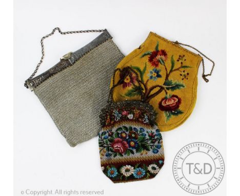A continental ladies white metal and metallic thread mesh evening bag, decorated with a landscape with windmills and figures;