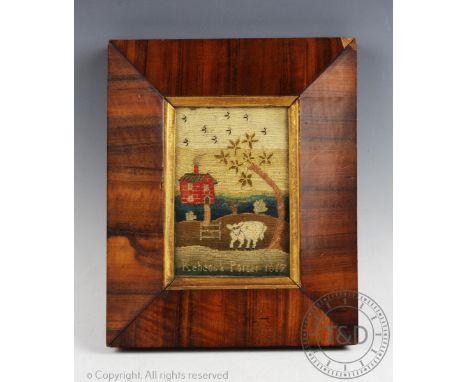 A late George III needlework picture, by Rebecca Porter 1817, worked with a red brick cottage and a cow, in walnut cushion fr