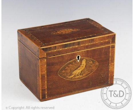An early 19th century inlaid mahogany tea caddy, decorated with a shell and a bird, with ivory escutcheon, (lacking internal 