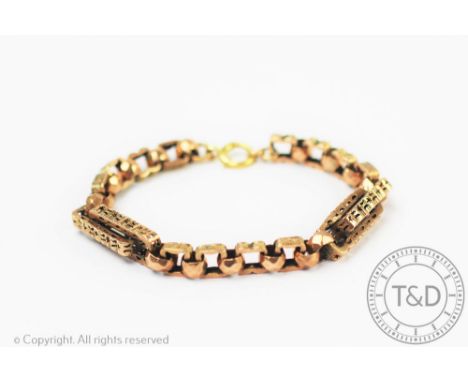 A Victorian Albert chain converted into a bracelet, the decorative link albert chain designed as pierced star and quatrefoil 