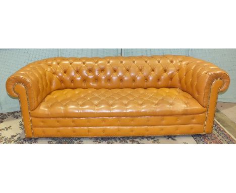 A leather-covered horse-hair-upholstered button-back-and-seat Chesterfield settee, 210cm wide.