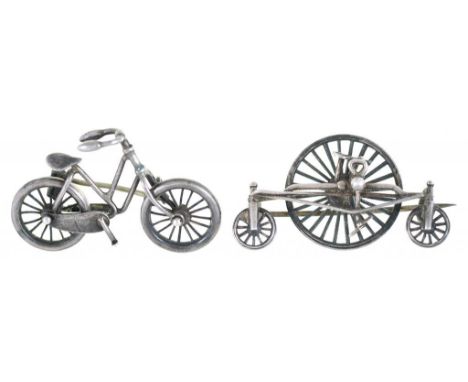 CYCLING. TWO UNUSUAL VICTORIAN SILVER BICYCLE AND TRICYCLE BROOCHES, ONE AS A RUDGE ROTARY TRICYCLE, THE OTHER AN EARLY LADIE