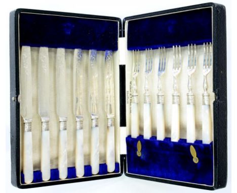 A SET OF SIX MOTHER OF PEARL HAFTED DESSERT KNIVES AND FORKS WITH SILVER FERRULES, BY WALKER AND HALL, CASED 