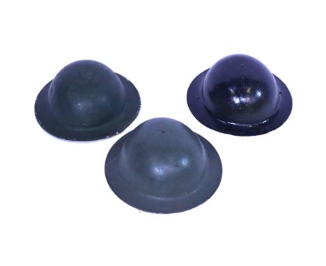 A collection of x3 WWII Second World War British Army Brodie helmets. All retaining liners and chin straps, some with Second 