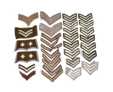 A collection of WWI First World War and Second World War style British Army chevrons to include Corporal, Sergeant and Privat