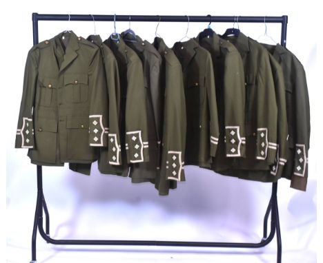 A collection of x10 reenactment WWI First World War British Army Captains cuff rank tunics. Each with Royal coat of arm brass