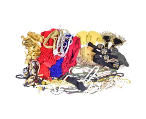 A collection of assorted military uniform braided tassels, aiguillettes and epaulettes.&nbsp;&nbsp;