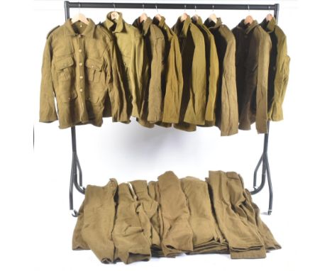 A large collection of re-enactment WWI First World War British Army / General Service Corps uniform tunics and trousers. All 
